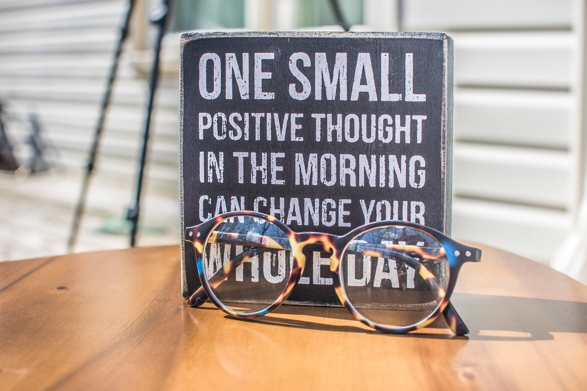 photo of a placard that says, "one small positive thought in the morning can change your whole day"