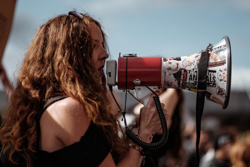 london woman talking into megaphone