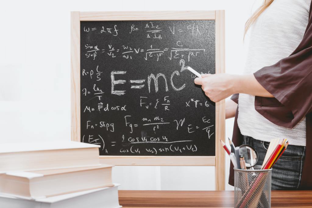 photo of chalkboard with albert einstein's e=mc^2 equation