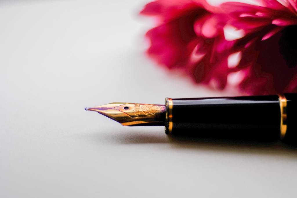 photo of a pen with flowers in the background