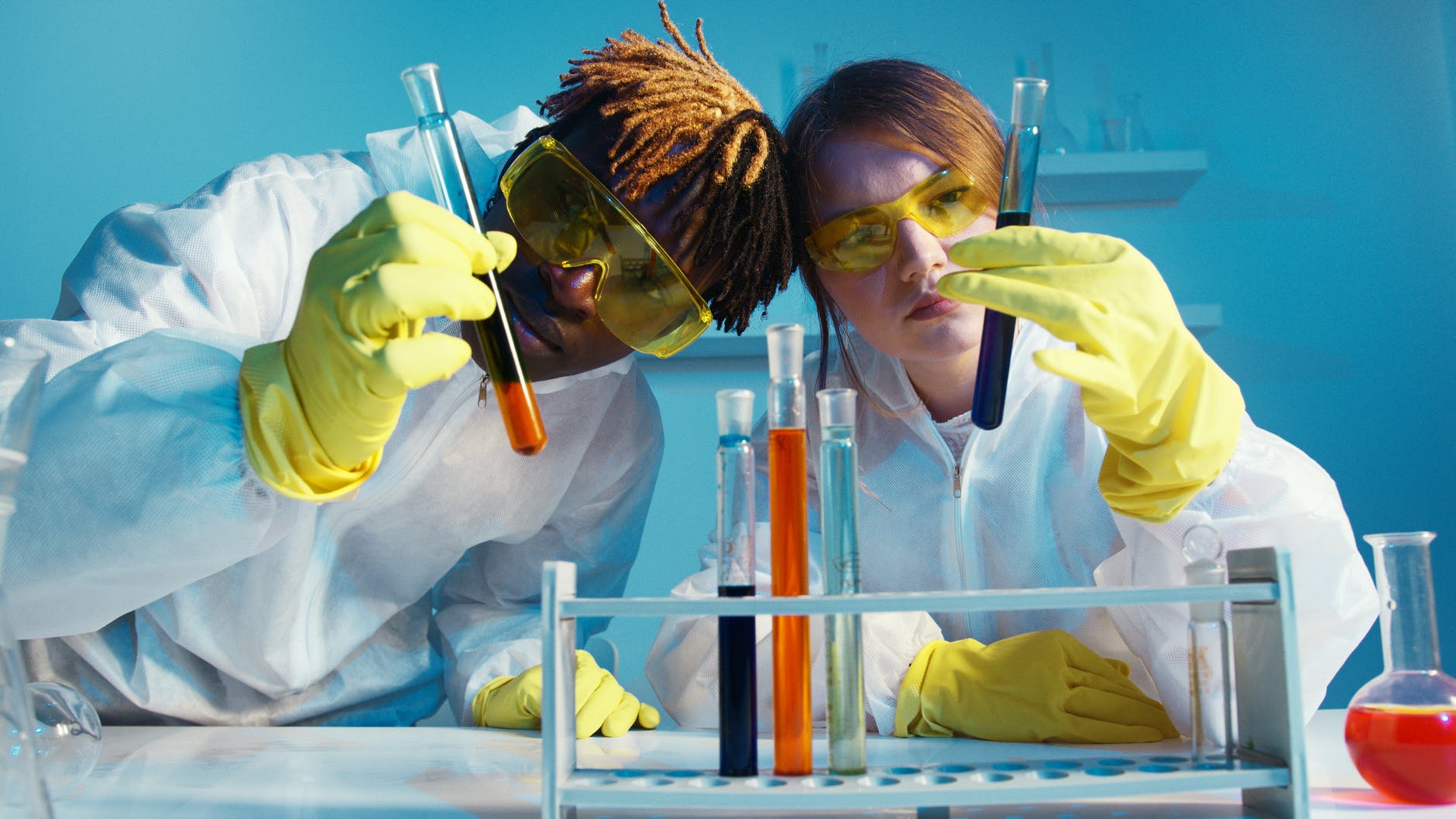 photo of scientists looking at test tubes
