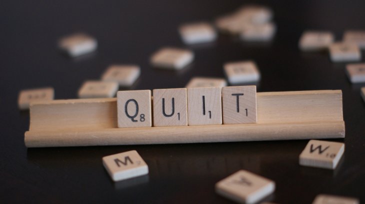 photo of scrabble letters that read, "quit"