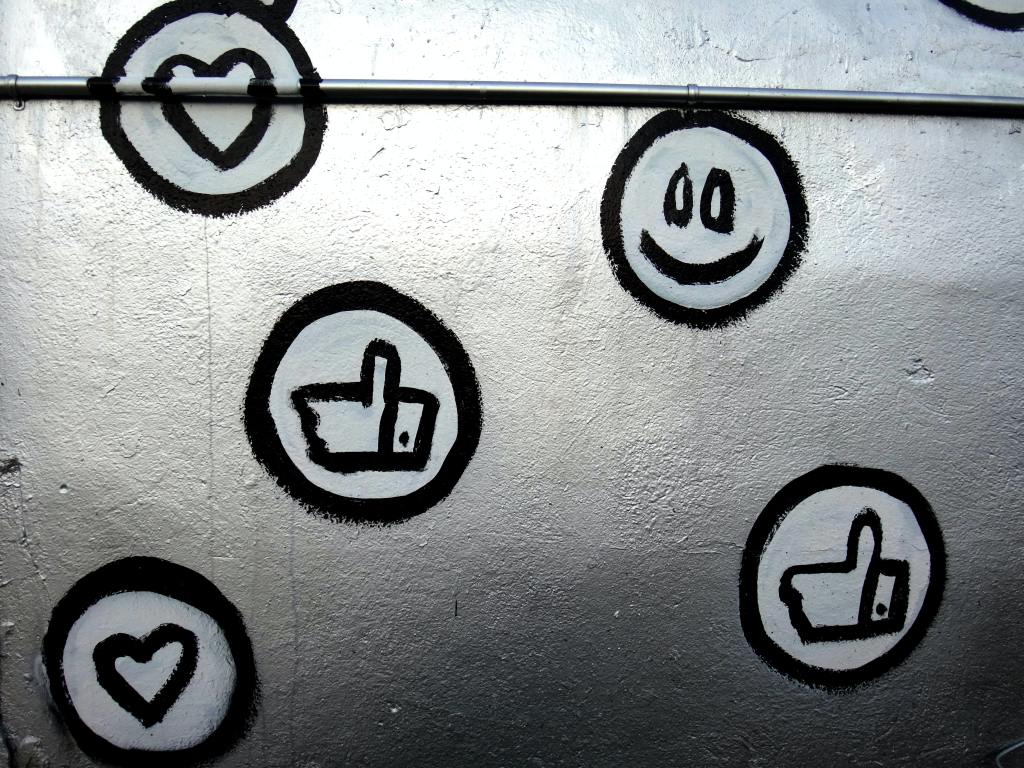 wall drawing of social media like and other reaction buttons