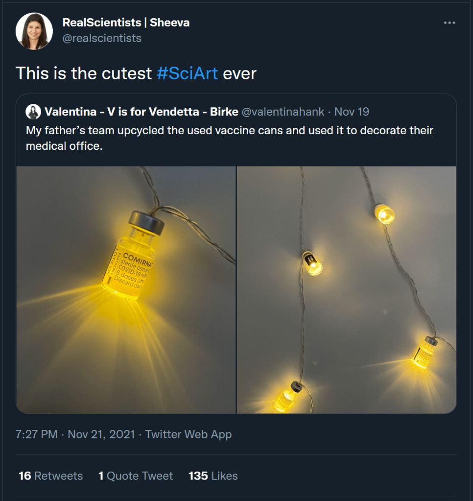 screenshot of a tweet depicting a string of christmas lights made with leftover pfizer vaccine containers