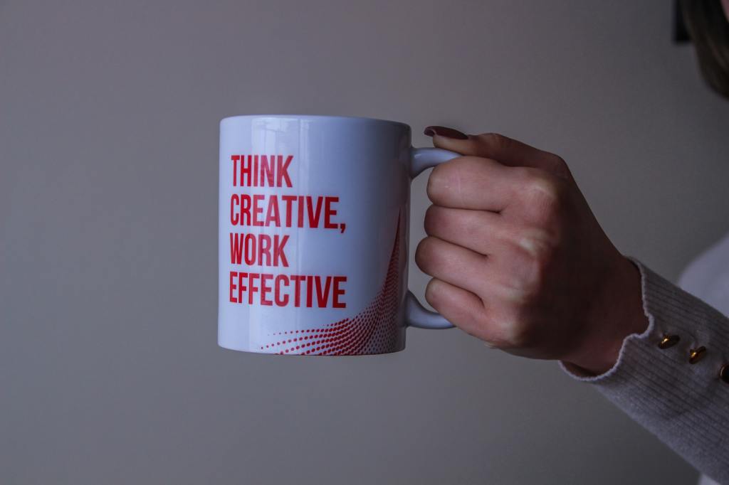 photo of a mug with text that reads 'think creative, work effective'