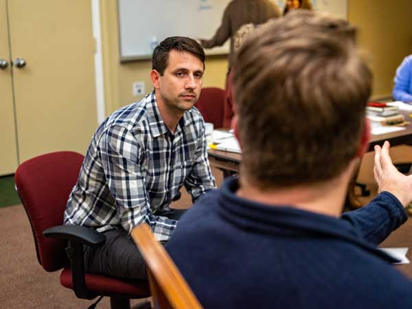photo of writer matthew shanks talking with david chrisinger, director of writing seminars for the war horse