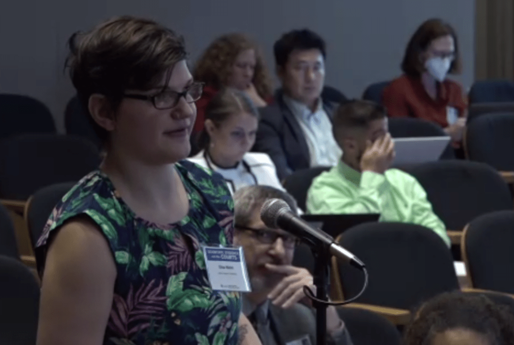 photo of a participant at the aaas scientific evidence and the courts seminar asking a question