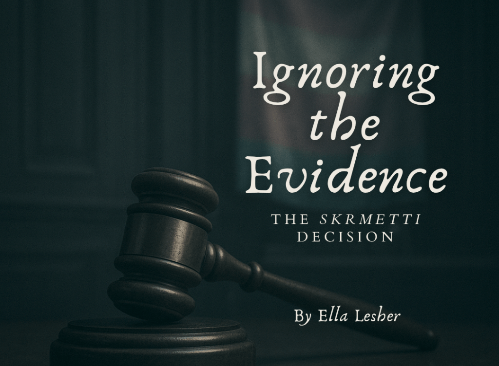 photo of a gavel with a transgender flag that says "ignoring the evidence: the skrmetti decision" by ella lesher