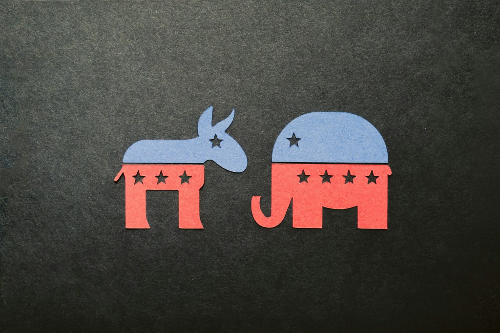 a picture of symbols of democrat and republican parties cut out of paper
